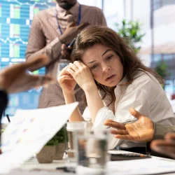 female-general-manager-trying-handle-organizational-crisis-meeting_482257-122864