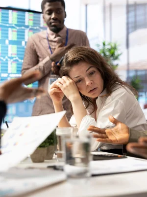 female-general-manager-trying-handle-organizational-crisis-meeting_482257-122864